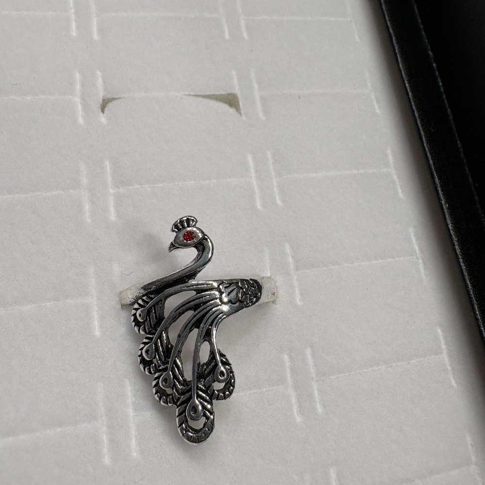Artistic Silver Peacock Ring with Red Accent